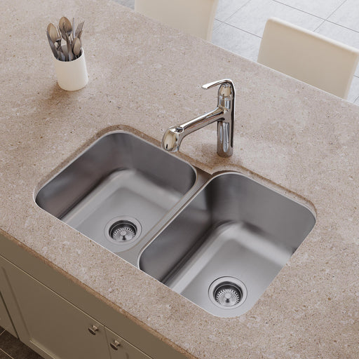 Stainless steel double-bowl undermount sink installed in a kitchen countertop