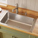 Installed stainless steel kitchen sink and curved faucet