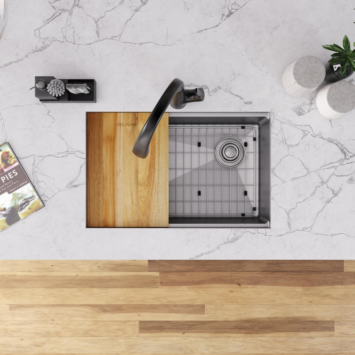 Overhead view of a workstation sink with cutting board, rack and grid
