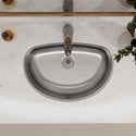 Top view of an oval stainless steel bathroom sink and faucet
