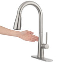 Brondell KFS15-SRS hand waving beside the sensor on the Jema touchless faucet in spotclear stainless