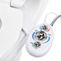 Brondell LH-22 SouthSpa controls beside a toilet seat, with connected hoses visible behind the panel