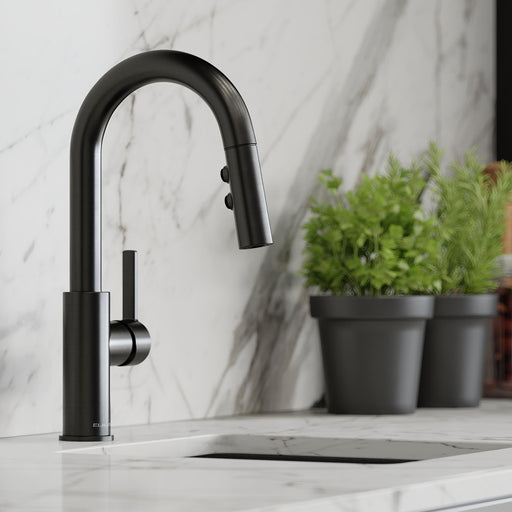 Black pull-down kitchen faucet installed against a light backsplash