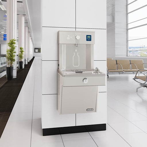 Elkay bottle filling station and drinking fountain installed against a white wall