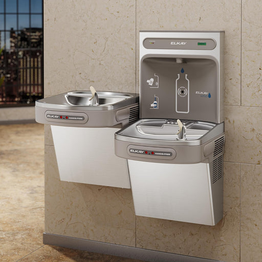Elkay bi-level bottle filling station and drinking fountains installed against a wall