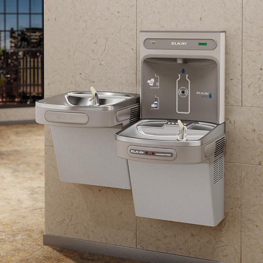 Elkay bi-level bottle filling station and drinking fountains installed against a wall