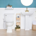 Brondell MBH-40-S stainless steel CleanSpa installed on a toilet in a blue-and-white bathroom