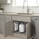 Brondell RC250 Capella filters and tank inside an open gray kitchen sink cabinet