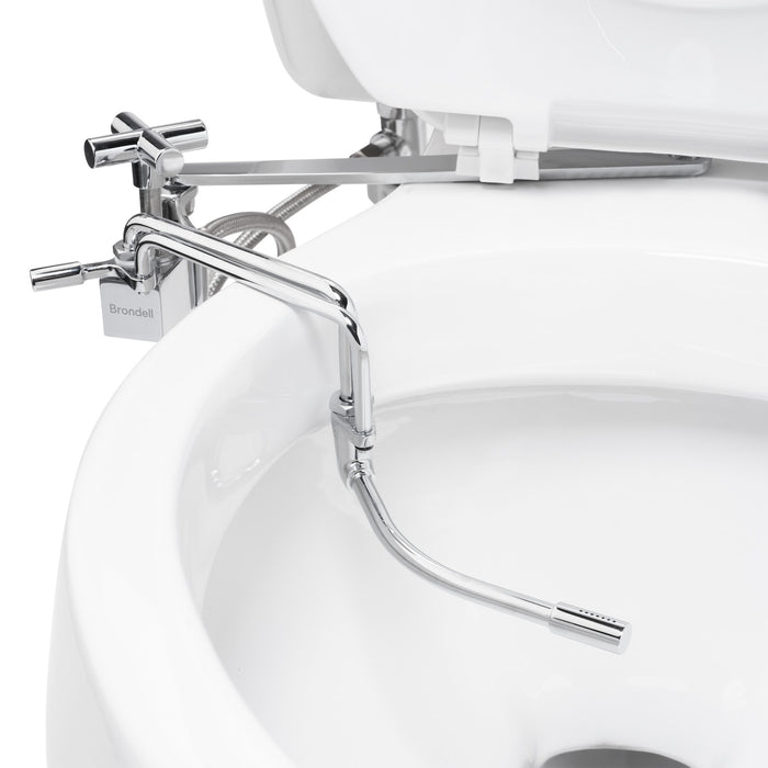 Brondell SMB-15 close-up of the bidet spray wand extended over the bowl beneath a raised seat